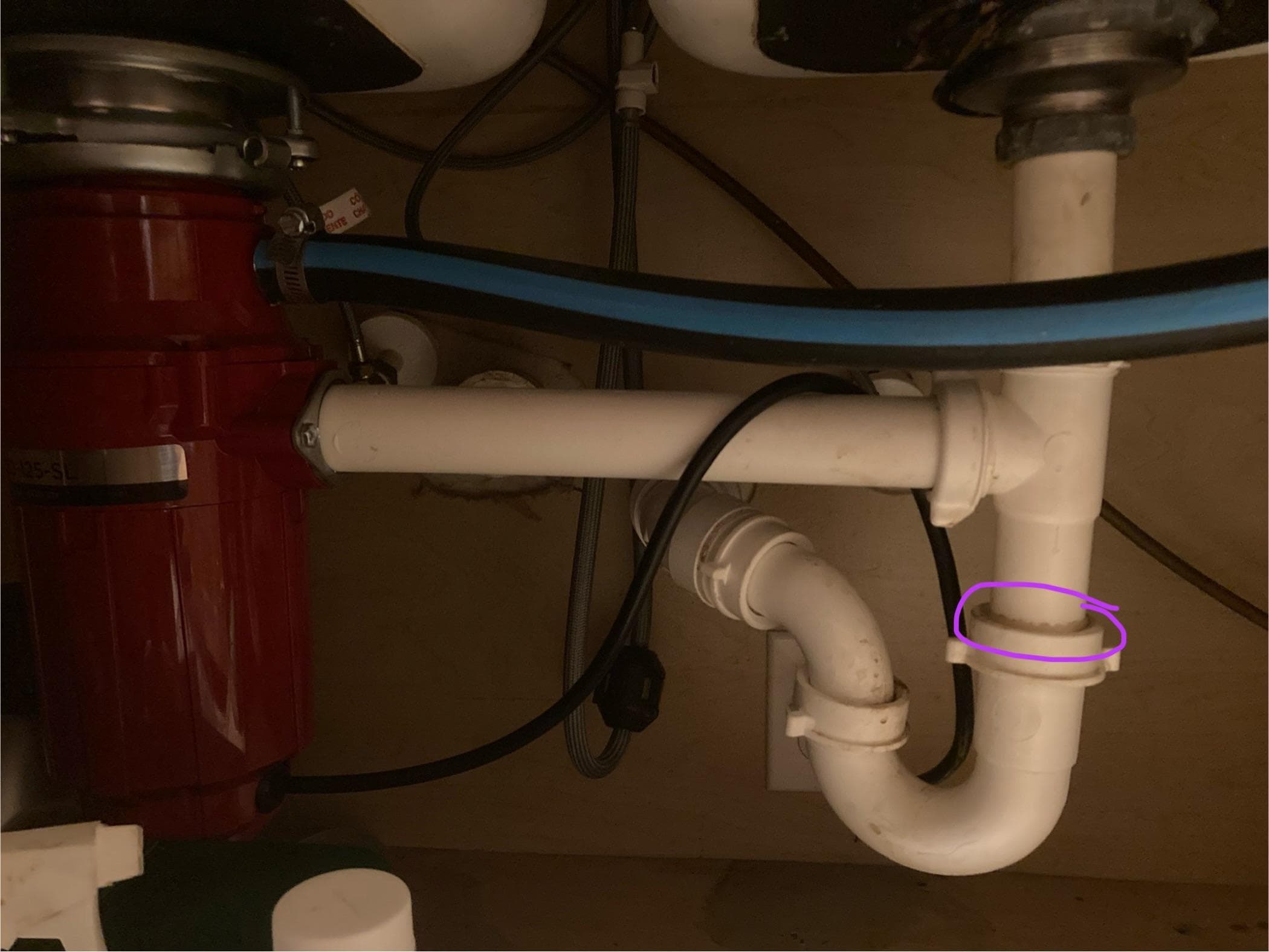 Leaking pipe under kitchen sink